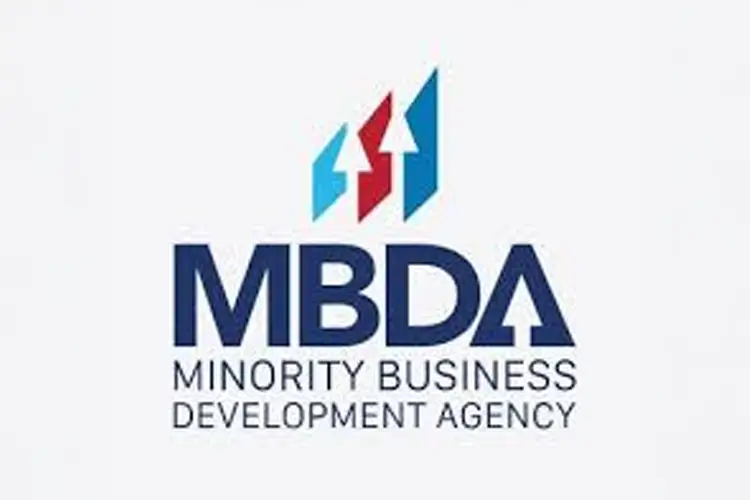 vAlt text: Navy blue acronym “MBDA” below three geometric arrows—sky blue, red, and teal—pointing upward, captioned “Minority Business Development Agency.