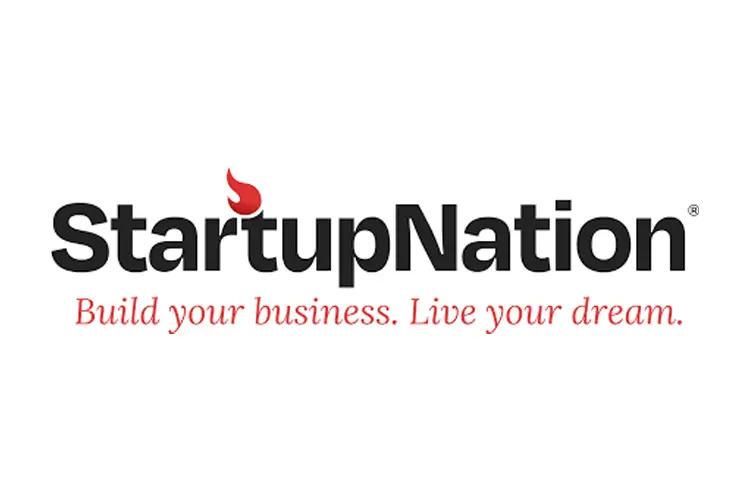 Alt text: Bold black “StartupNation” word-mark with a red stylized flame above the first “t,” tagline beneath reading “Build your business. Live your dream.” in red italics.