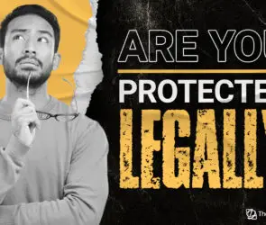 Thinking design entrepreneur holding a pencil, ready to protect her business legally.