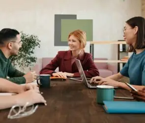 Group of diverse freelance design entrepreneurs having a meeting in a modern office