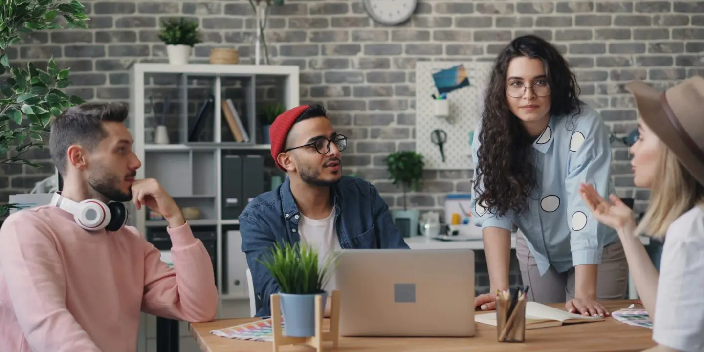 Diverse design team brainstorming creative ideas during a planning session.