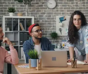 Diverse design team brainstorming creative ideas during a planning session.