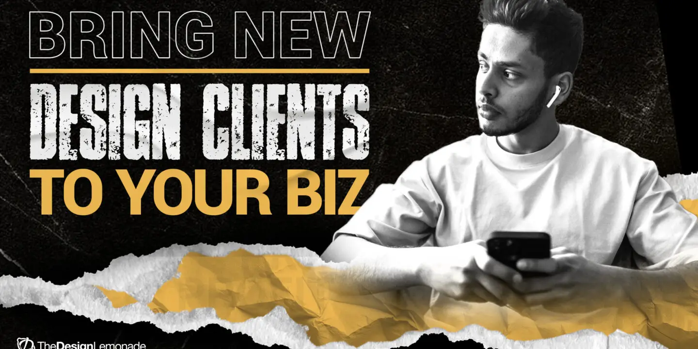 Focused designer using a smartphone and laptop to research and attract new design clients, symbolizing modern client acquisition strategies for creative entrepreneurs.