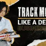 Female design entrepreneur reviewing income and expense records on a digital tablet, representing smart financial tracking for design business success.