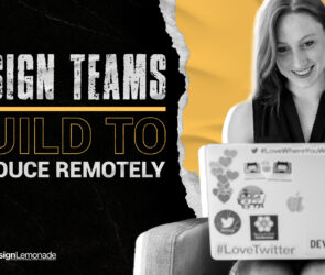 Smiling designer working remotely on a laptop covered with stickers, representing creative collaboration and remote design team productivity.