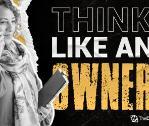 Entrepreneur speaking on phone holding tablet device.