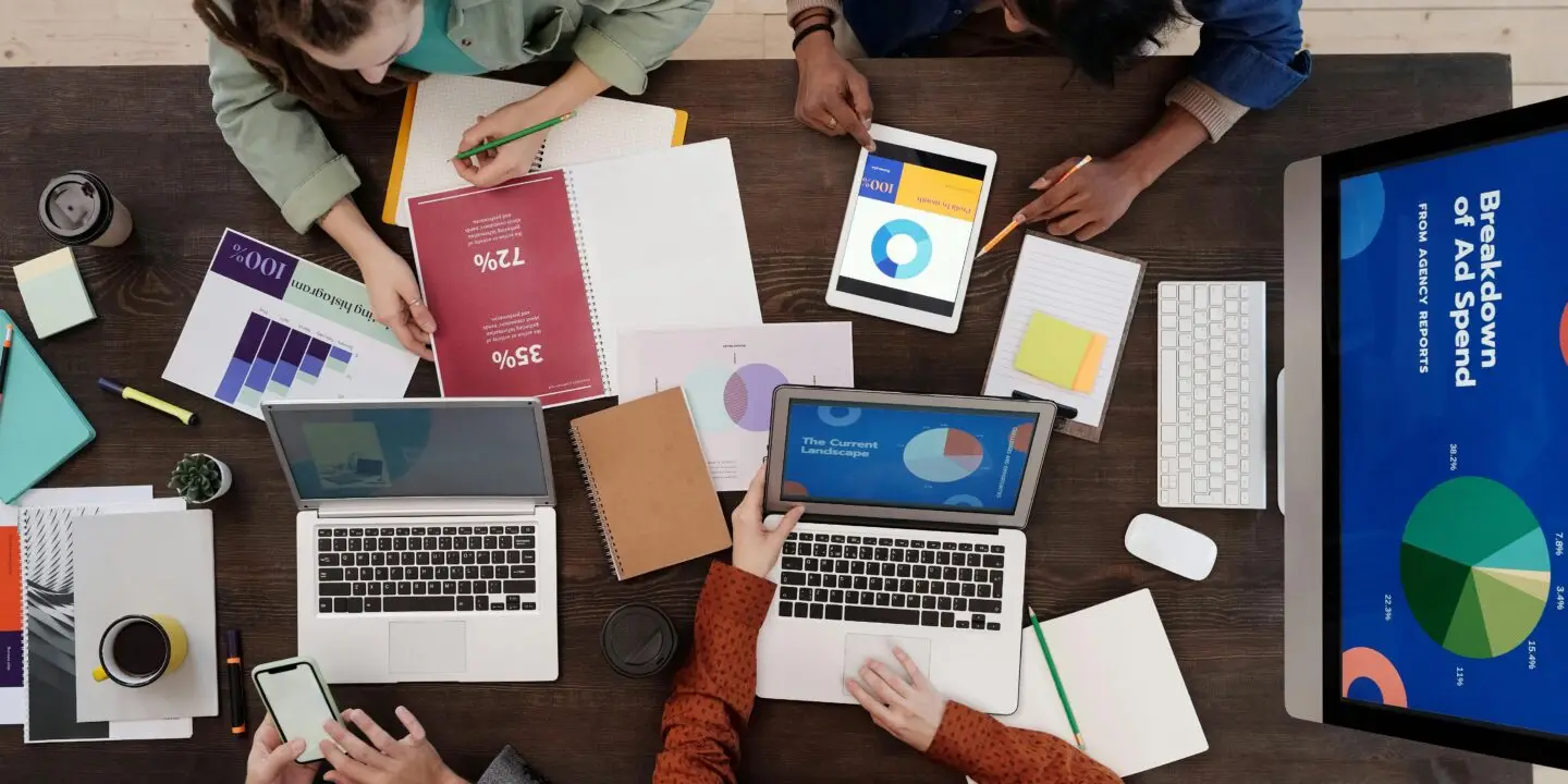 Team analyzing marketing reports and performance charts.